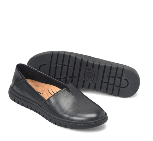 A pair of blackBorn Sebra slip-on leather shoes, with one shoe showing the side profile and the other showing the textured outsole, set against a plain white background.