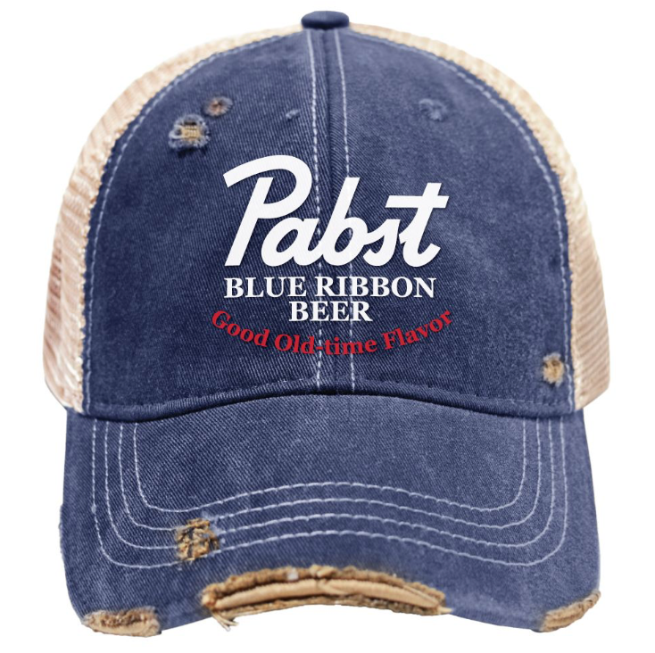 A distressed blue denim trucker hat with beige mesh back panels, featuring 'Pabst Blue Ribbon Beer' and 'Good Old time Flavor' printed on the front.