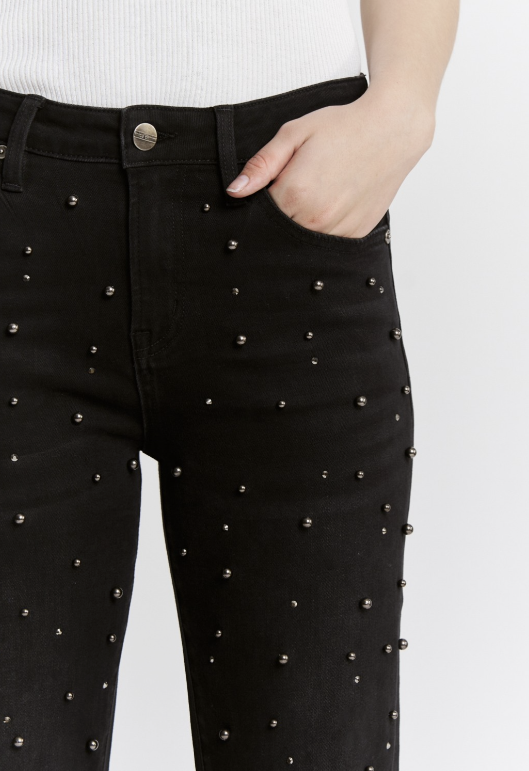 Black high‑rise pearl‑embellished jeans with soft‑stretch denim and slim leg.