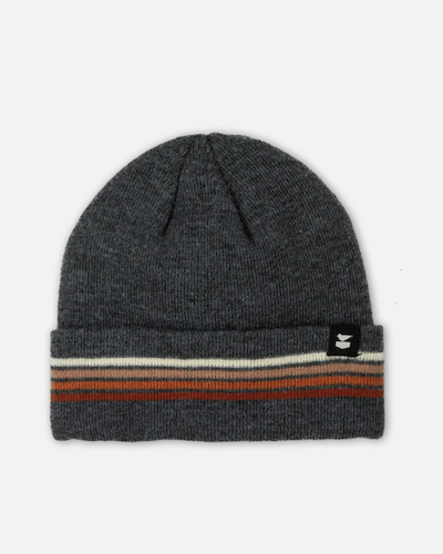 A Jetty Wayland dark gray heather knit beanie with a folded cuff featuring horizontal stripes in cream, rust orange, and dark brown, finished with a small black brand patch on the side.