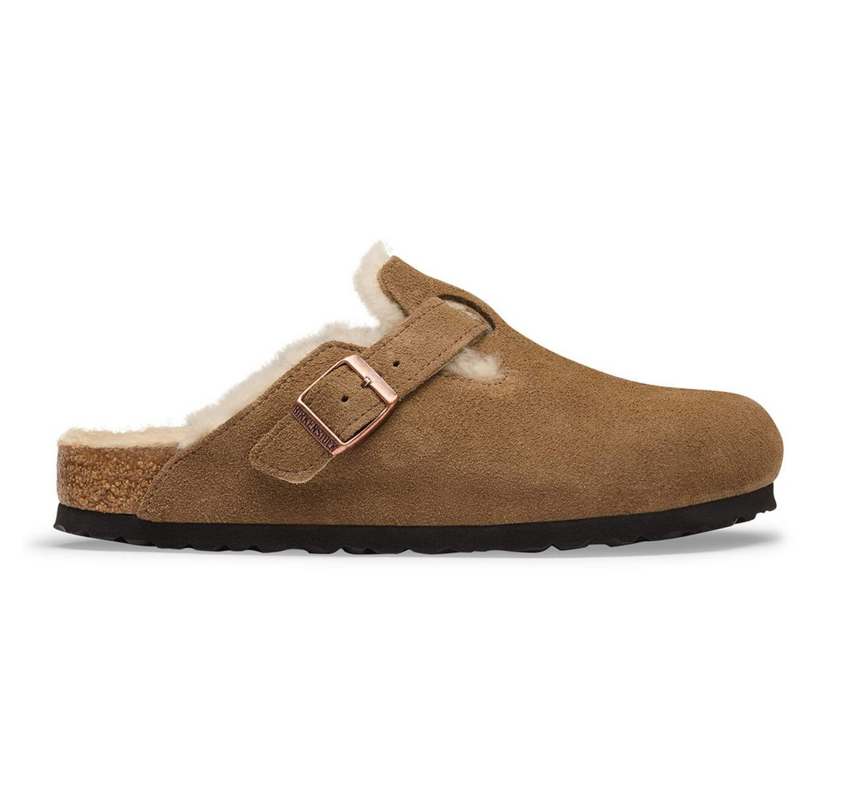 A classic Birkenstock clog-style mule shoe in tan suede with a light beige shearling lining, a single adjustable strap with a rose gold buckle, and a black outsole, shown from a side profile on a white background.