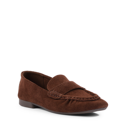 A single Seychelles Day Trip brown suede loafer flat shoe with a braided detail on the vamp, shown from a three-quarters angle against a plain white background.