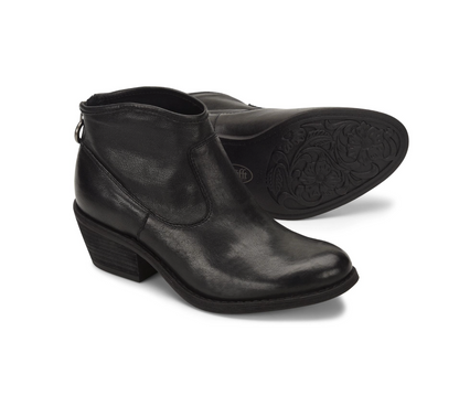 A pair of Sofft Aisley black leather ankle boots, with one boot standing upright to show the side and heel, and the other lying flat to display the decorative floral embossed outsole.