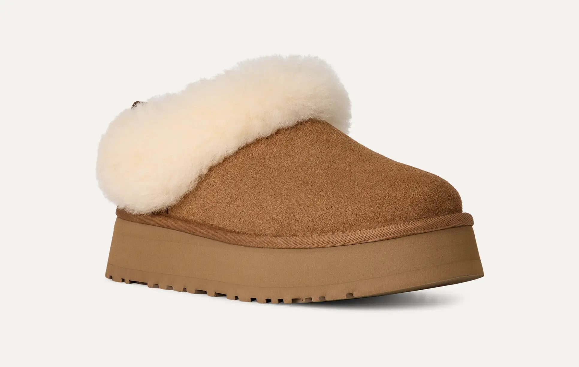 UGG chestnut suede Tazzette slipper with plush wool lining and a platform sole.