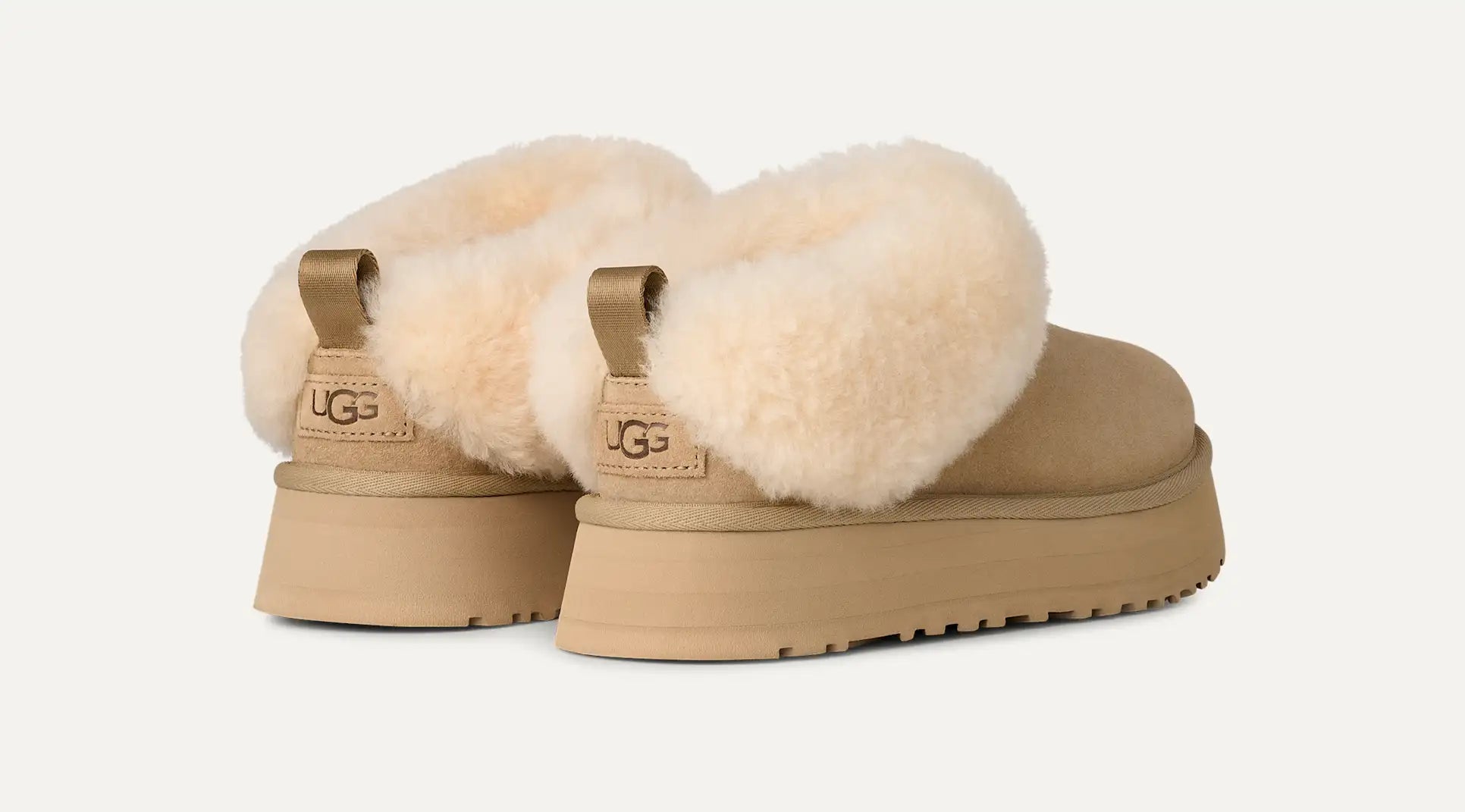 Women’s UGG Tazzelle slipper in mustard seed suede with plush UGGplush lining and a lightweight platform sole.