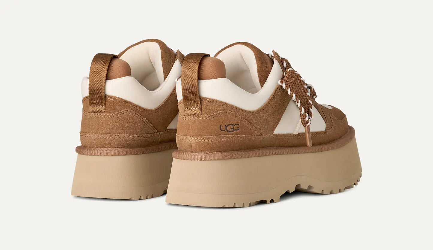 Women’s UGG Astromel sneaker in chestnut suede with mesh panels and a lightweight SugarSole EVA outsole.