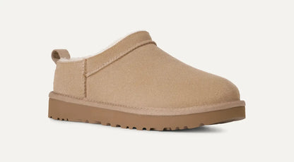 Women’s UGG Classic Micro Slipper in sand suede with plush sheepskin lining and an ultra‑low silhouette.