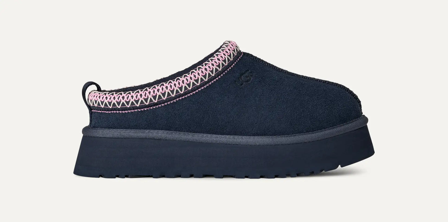 Women’s UGG Tazz II slipper in dark indigo suede with UGGplush lining, braid collar, and a 1.75-inch platform sole.