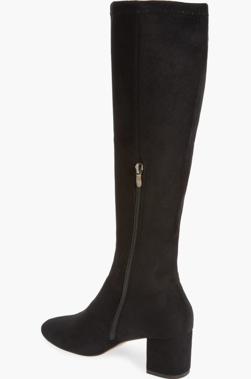 A black knee-high boot with a block heel and a side zipper, shown from a side profile view against a plain white background.