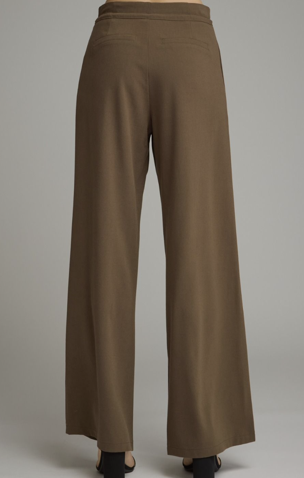 The back side of Entro Wide‑Leg Pants with Drawstring Waist featuring a lightweight woven fabric and relaxed wide‑leg silhouette.
