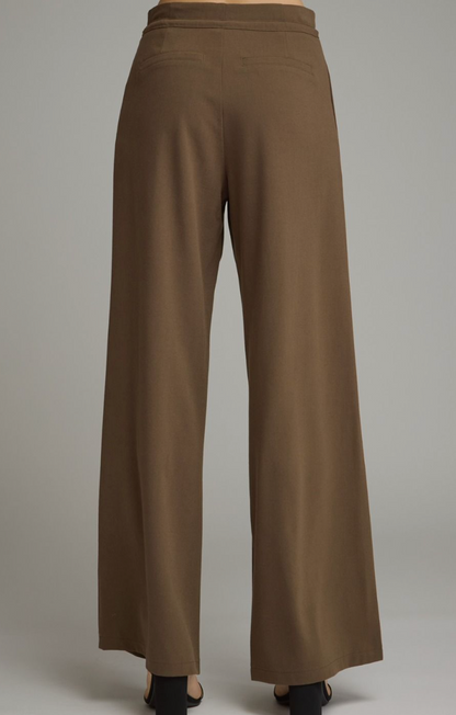 The back side of Entro Wide‑Leg Pants with Drawstring Waist featuring a lightweight woven fabric and relaxed wide‑leg silhouette.

