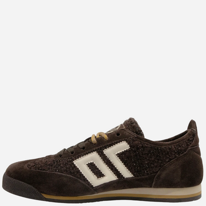 A dark brown suede and textured knit Back 70 sneaker with a prominent off-white geometric side logo, tan laces, and a gum sole, shown against a plain light gray background.