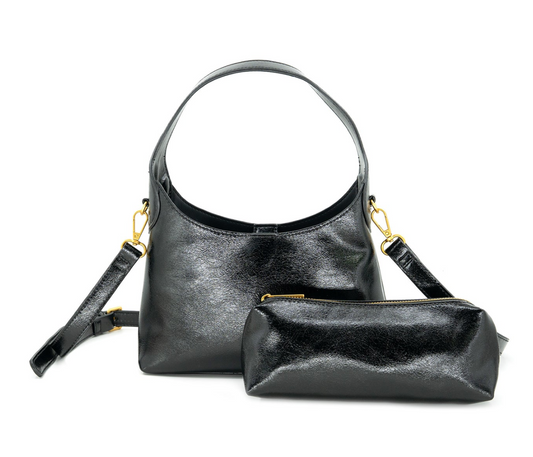 A black textured leather hobo handbag with a matching zippered pouch, both featuring gold-tone hardware, displayed on a clean white background.