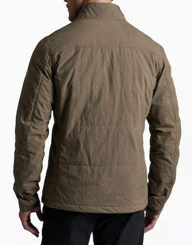 A man wearing a brown Kuhl Wylderydr  quilted jacket, shown from the back against a plain white background.