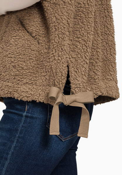 enana oversized faux‑fur vest in mocha with plush high‑pile texture.