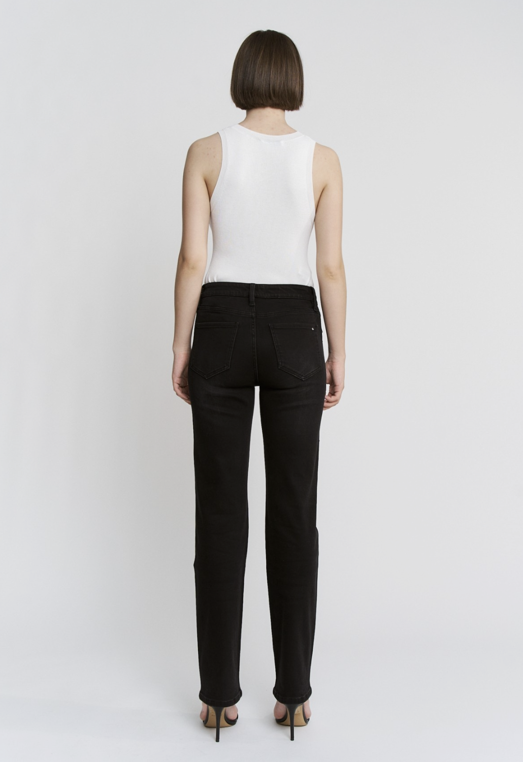 Black high‑rise pearl‑embellished jeans with soft‑stretch denim and slim leg.