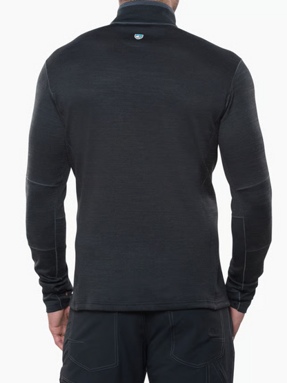 Back view of a man wearing a Kuhl Ryzer dark charcoal gray long-sleeve quarter-zip fleece pullover and dark pants, photographed against a clean white background.