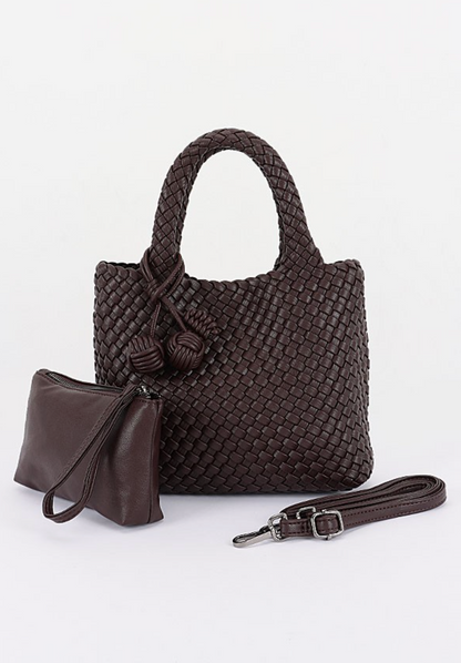 A dark brown woven leather handbag with dual top handles, a matching small zip pouch, and a detachable shoulder strap, displayed on a clean white background.