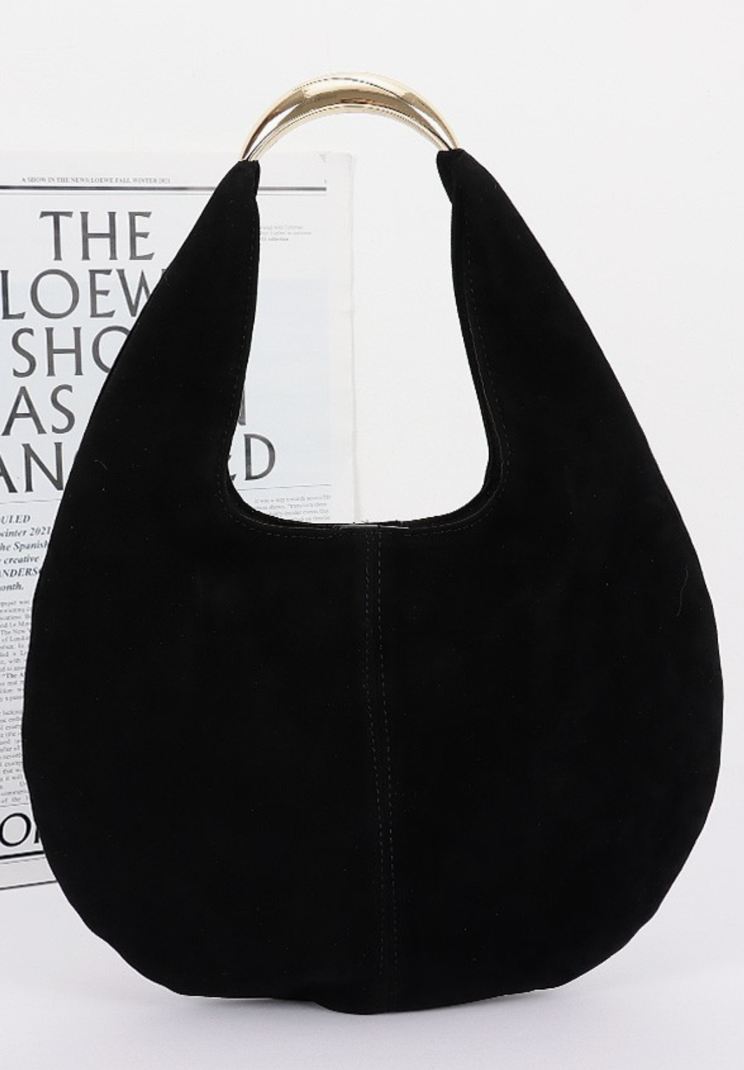 Faux suede hobo bag with relaxed silhouette and minimalist hardware in black.