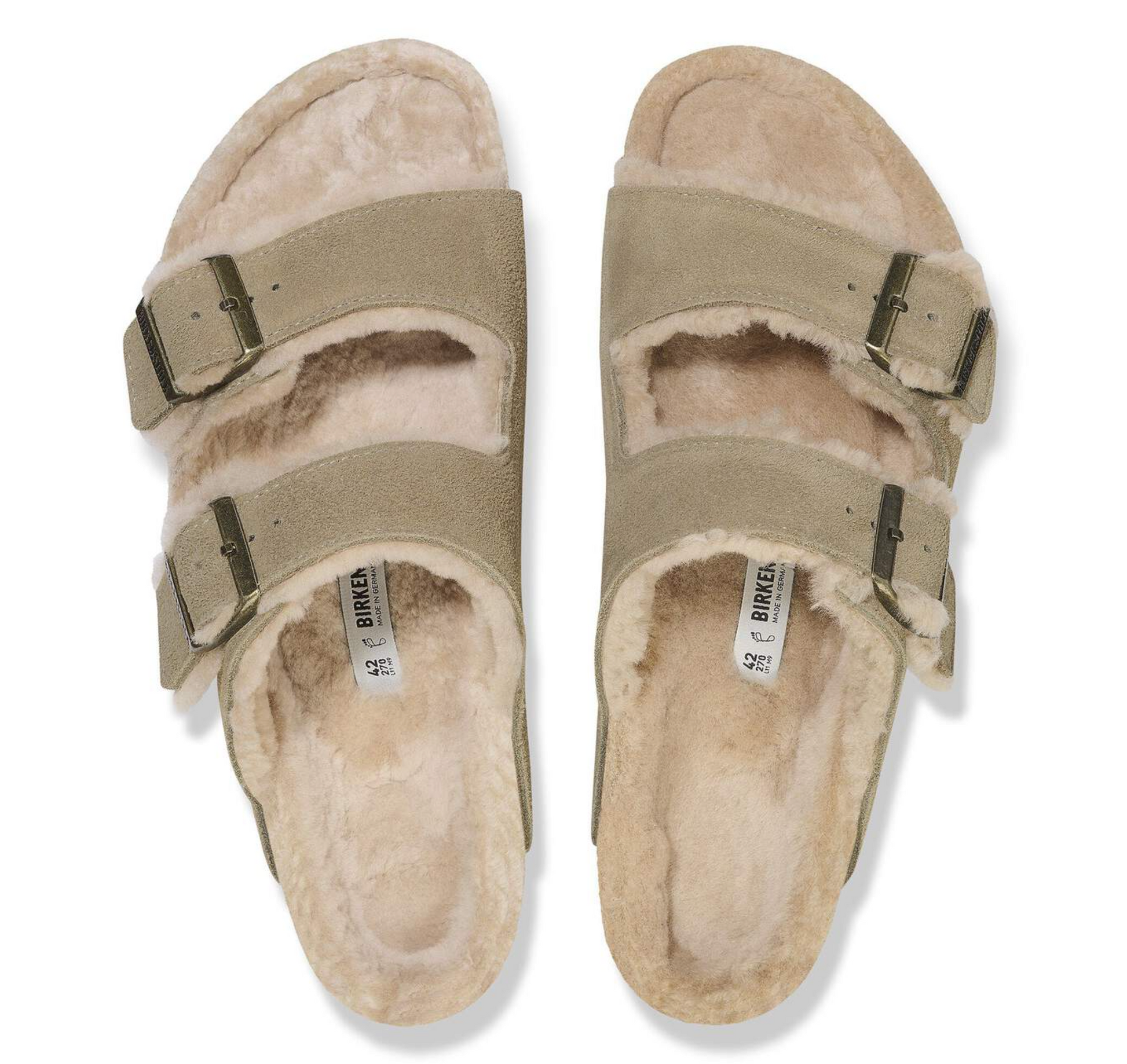 A pair of Birkenstock Arizona shearling slide sandals with beige suede straps, adjustable buckles, and a plush cream shearling lining, shown from a top-down view on a white background.