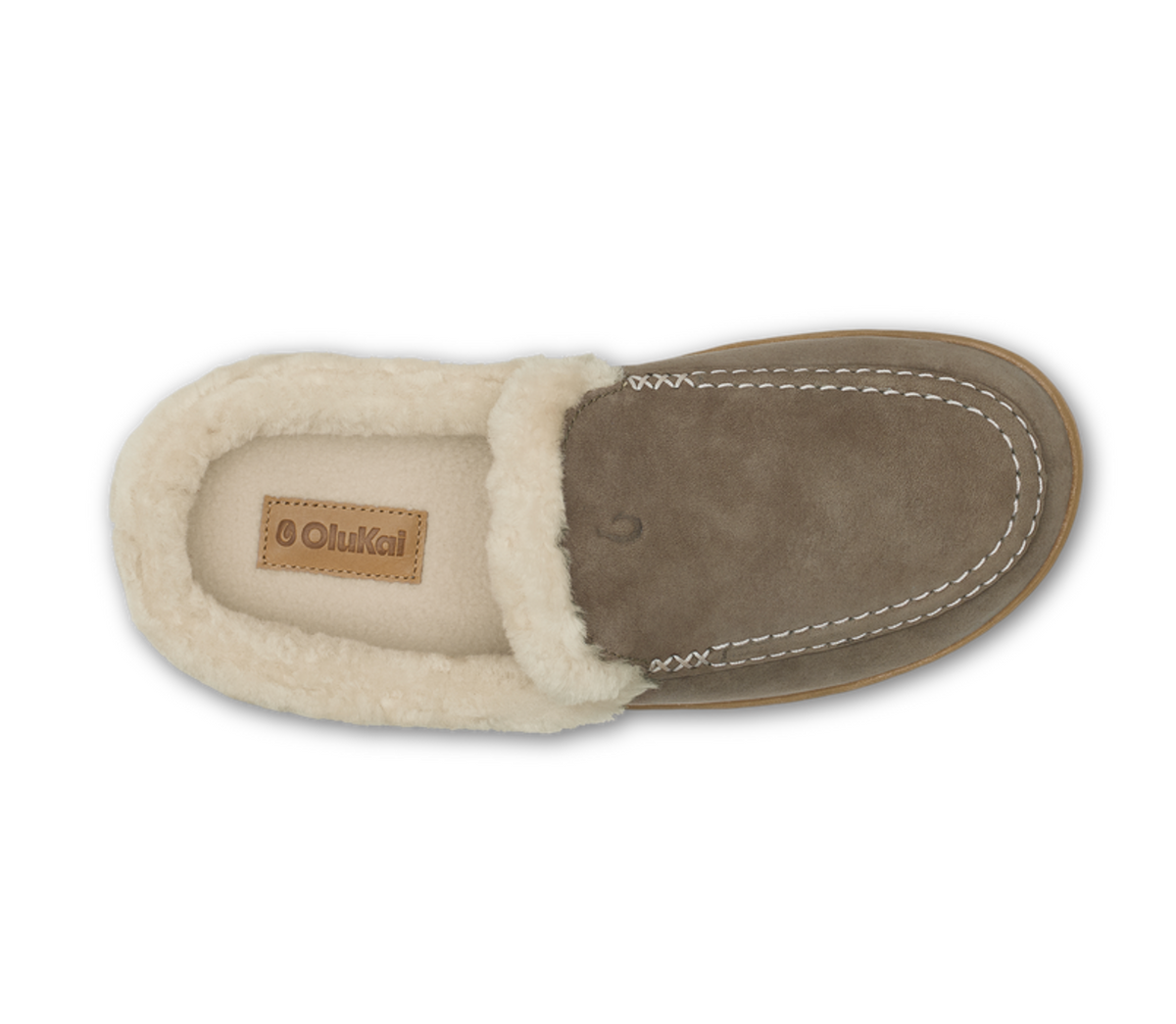 A single Otukai slip-on moccasin-style shoe shown from a top-down view, featuring a taupe suede upper, white shearling lining, and a tan brand patch on the insole.