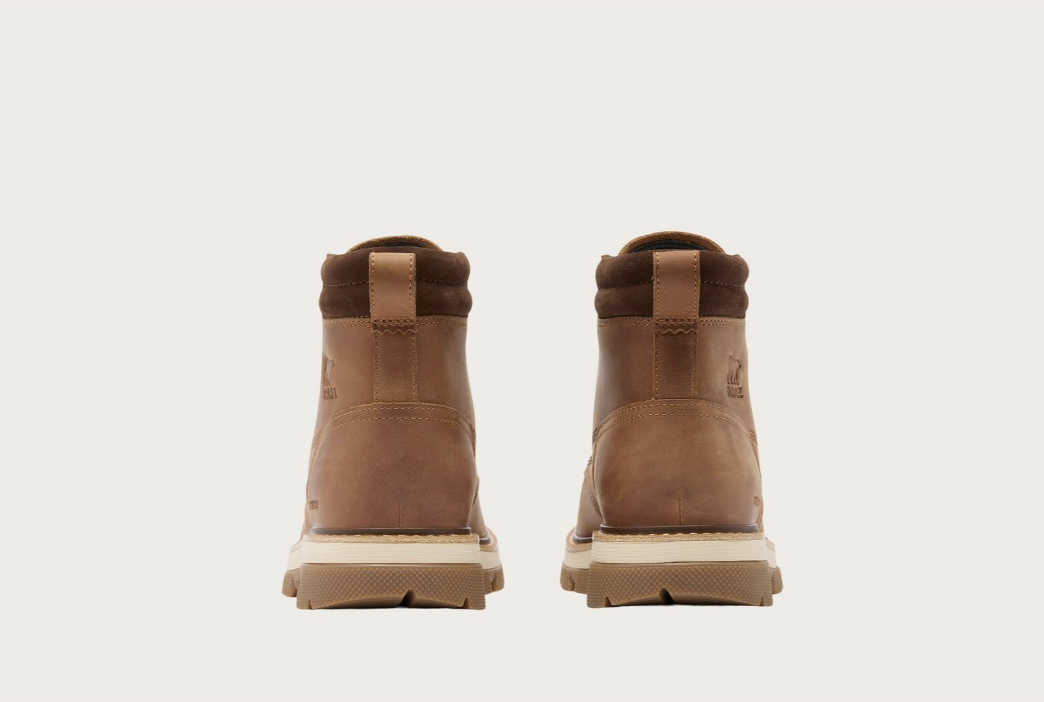 Sorel Lark‑47 men’s moc‑toe waterproof boot in velvet tan and tobacco with rugged traction outsole.