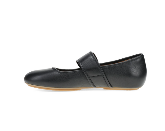 A Dansko Matilda black pebbled leather Mary Jane flat shoe with a single strap across the top, shown in a side profile on a white background.