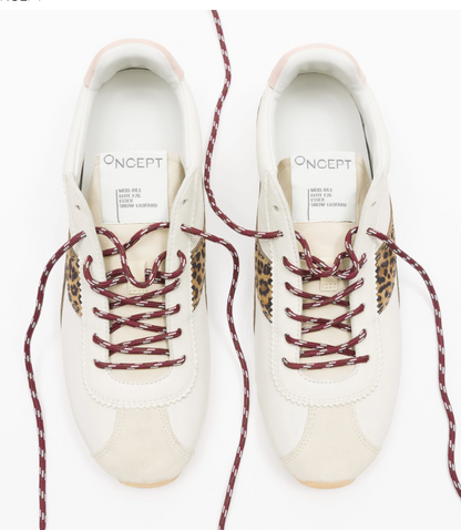 A pair of Off-White Oncept sneakers in off-white leather with burgundy and leopard-print laces, shown from a top-down view on a white background.