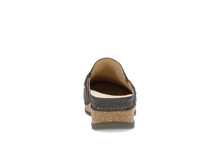 Dansko Maggy open‑back clog with burnished leather and cork/EVA midsole.