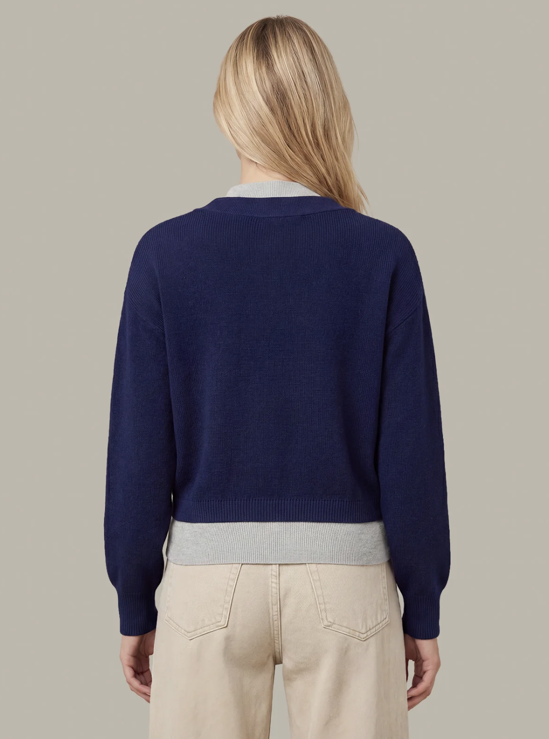 Dark‑blue lightweight v-neck pullover with soft drape and refined silhouette.