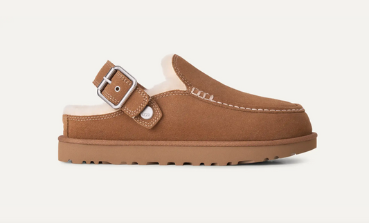 A single brown suede UGG mule clog with a wide adjustable strap and silver buckle, featuring a soft cream shearling lining and a thick brown sole, shown against a plain off-white background.