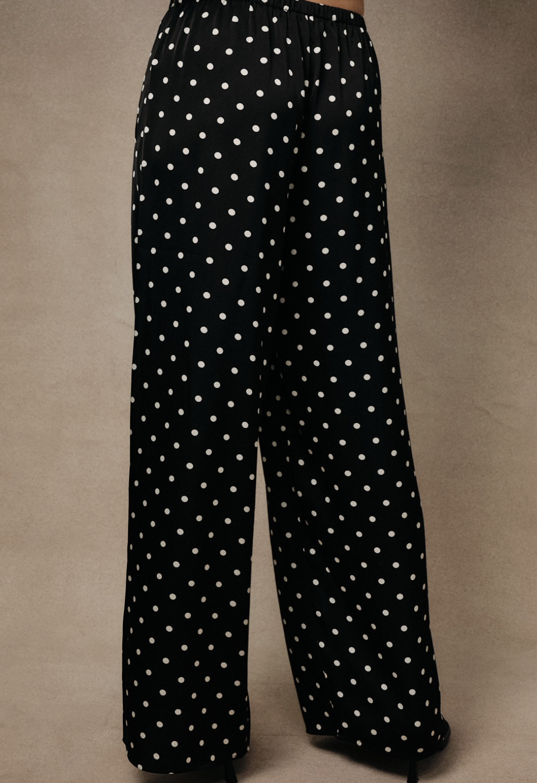 unday Edition black satin with white polka dot wide‑leg pants with pull‑on waistband.