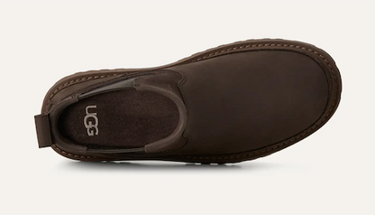 A dark brown UGG Birch slip-on boot shown from a top-down view against a light off-white background.