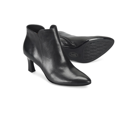 A pair of Sofft Sasha black leather ankle boots with kitten heels, shown on a clean white background. One boot is positioned upright to show the side and front profile, while the other lies on its side displaying the treaded outsole with the 'Saff' brand logo.