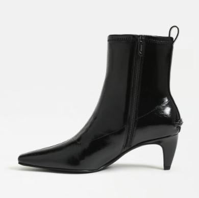 A Circus Inez black patent leather ankle boot with a pointed toe, a low kitten heel, and a side zipper, shown against a plain white background.
