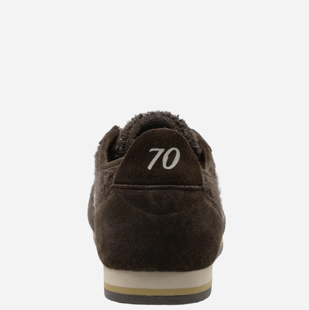 A close-up rear view of a dark brown suede Back 70 sneaker with a plush brown lining, featuring the number '70' printed in white on the heel tab and a beige and brown sole.