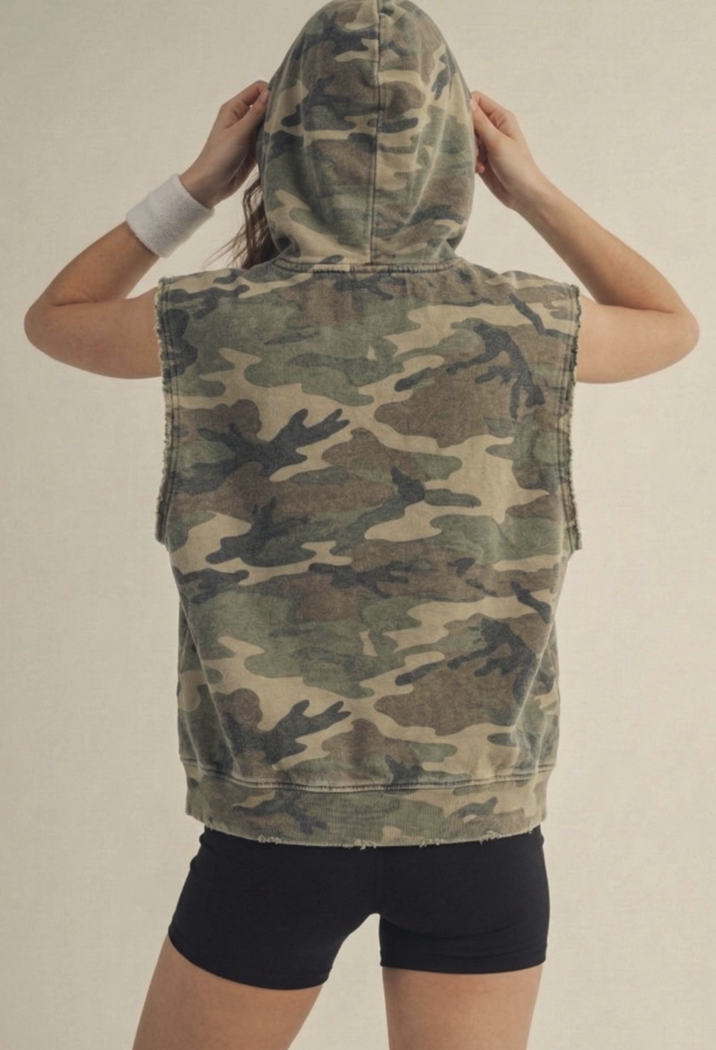 The back side of LovLov Vintage Sleeveless Hoodie with vintage‑washed finish and sleeveless sporty silhouette.