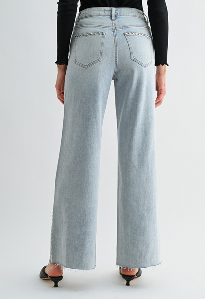 Neptune‑wash raw‑hem studded jeans with soft‑stretch denim and polished‑edgy detailing.