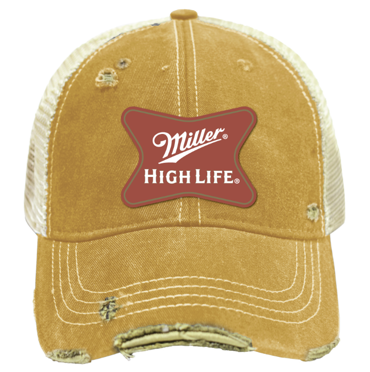 A distressed yellow trucker hat with a red Miller High Life patch on the front, featuring cream mesh back panels and simulated wear details.