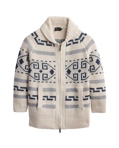 A cream-colored Pendleton wool-knit zip-up cardigan sweater with a high ribbed collar, featuring a navy blue and light gray geometric Fair Isle pattern on the chest and sleeves, shown against a plain white background.