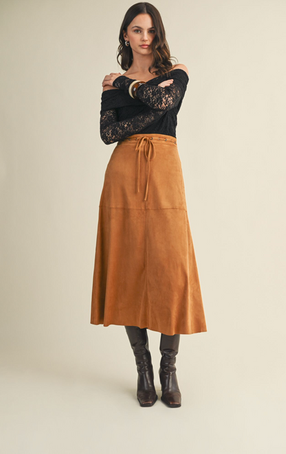 Mustard Seed faux‑suede A‑line skirt in beige or camel with soft texture and flattering silhouette.