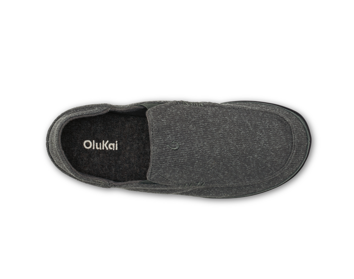 A single Olukai Moloa Hulu dark gray slip-on shoe shown from a top-down view on a white background, with the brand name 'OluKai' printed on the black inner sole.