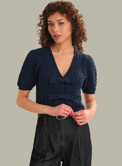 Dark‑blue 525 America Alexandra Bow Cardigan with bow‑accent placket and lightweight knit.