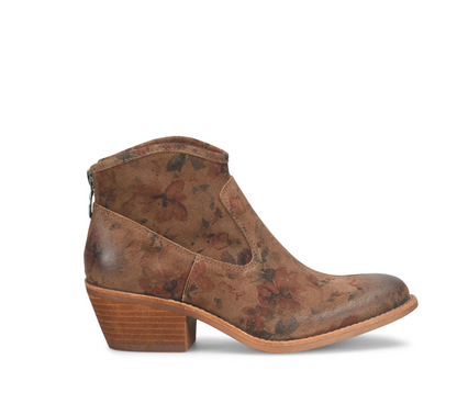 A Sofft Aisley brown leather ankle boot with a distressed floral pattern in muted red and brown tones, featuring a stacked wooden-look block heel and a side zipper.