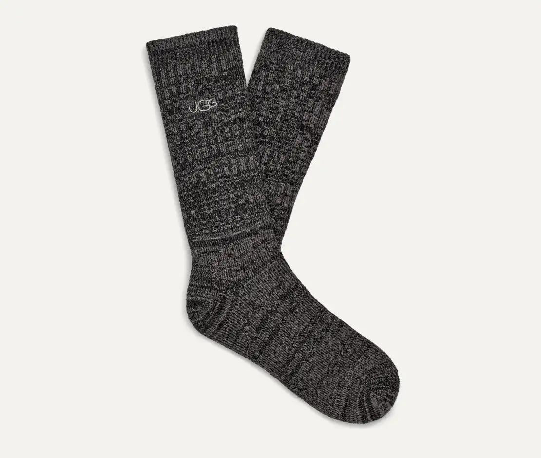 Pair of gray UGG Tray Rib socks with a textured pattern on a white background