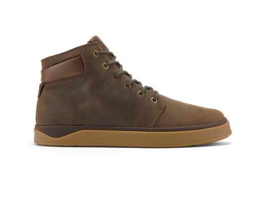 A Olukai Kekaha brown high-top leather boot with a gum rubber sole, shown in a side profile on a white background.