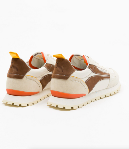 A pair of retro-style Oncept sneakers shown from the rear, featuring cream and brown panels with bright orange accents on the soles, heel tabs, and lining, set against a plain white background.