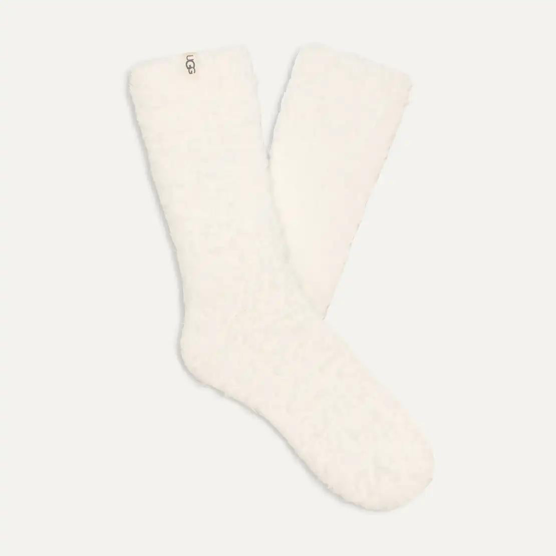 A pair of off-white UGG Teddi Cozy textured fleece crew socks displayed against a solid light gray background.