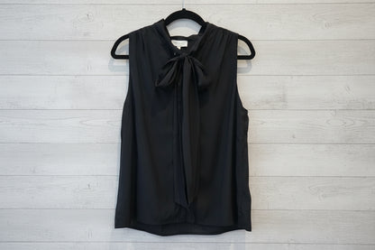 Black tie‑neck button‑down blouse with soft drape and feminine neckline detail.