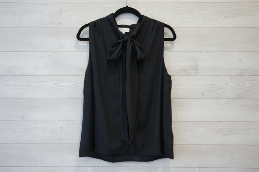 Black tie‑neck button‑down blouse with soft drape and feminine neckline detail.